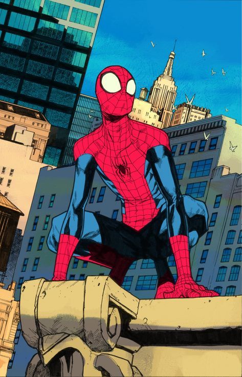 the spider - man is sitting on top of a building