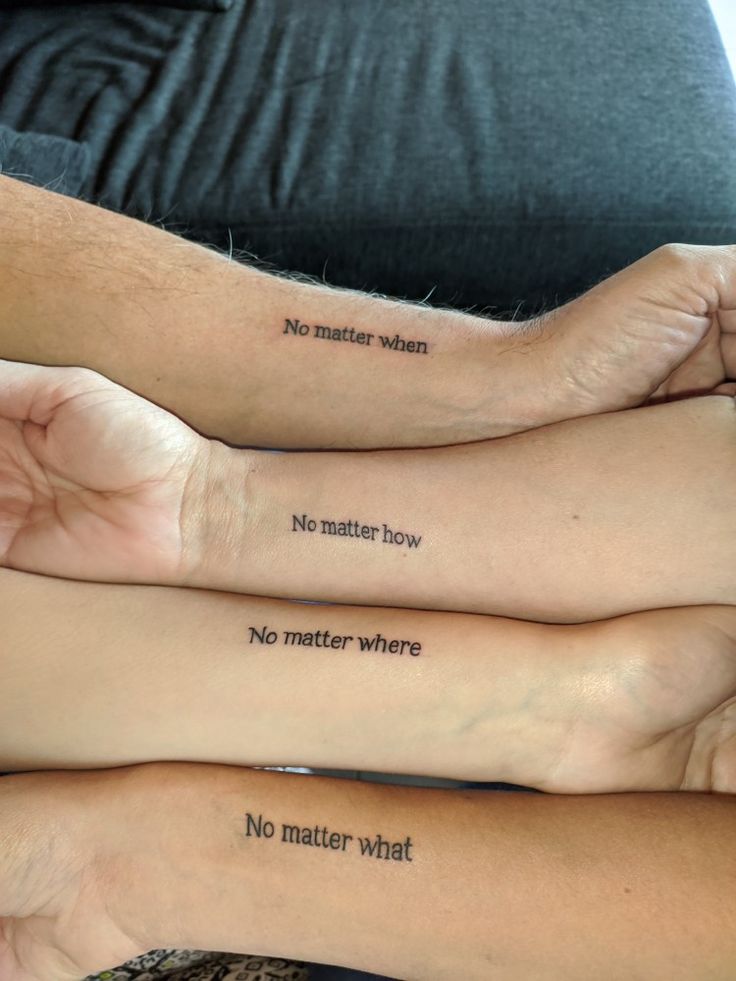 three people with matching tattoos on their arms