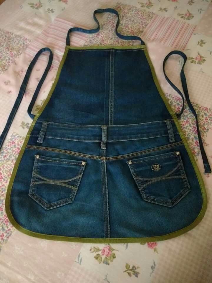 an apron made out of jeans is laying on the bed