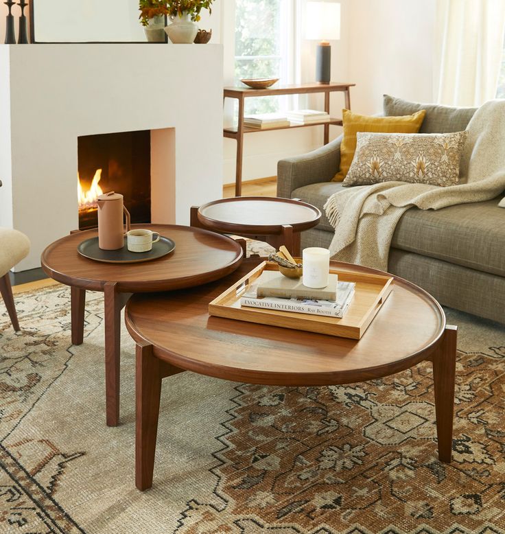 a living room filled with furniture and a fire place