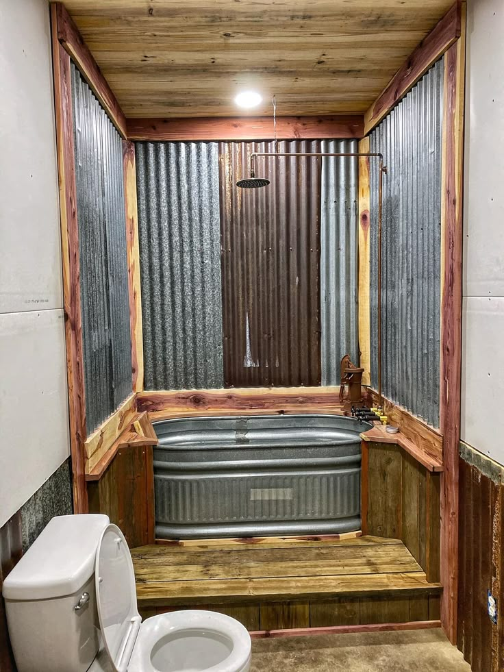 a bathroom with a tub, toilet and shower stall is shown in this image from the inside