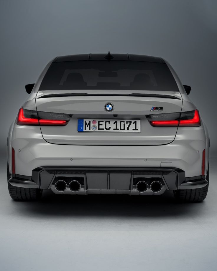 the rear end of a white bmw car