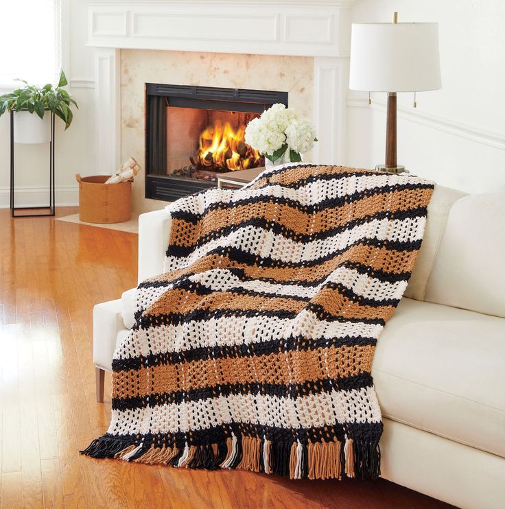 a living room with a couch and fireplace