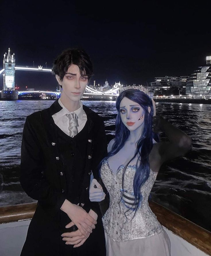 a couple dressed up as corpse bride and groom on a boat in london at night