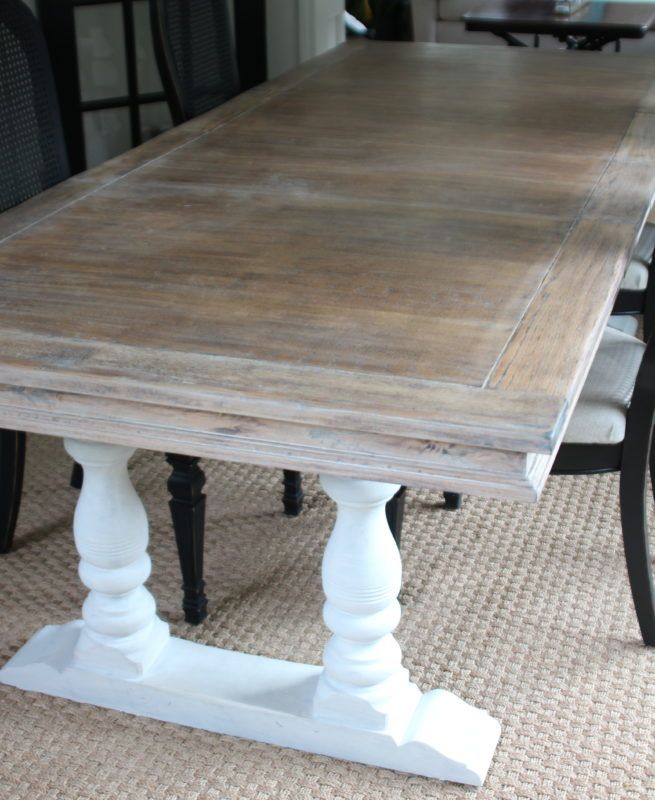 a wooden table sitting on top of a carpeted floor