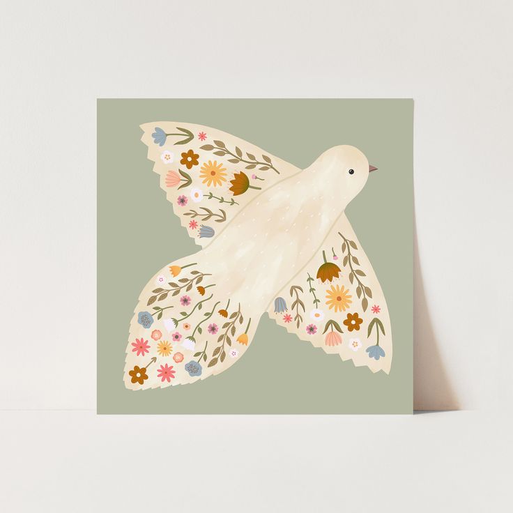 a card with a white bird on it's wings and flowers around its body