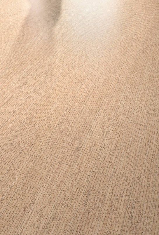 a person riding a skateboard on top of a hard wood floored flooring