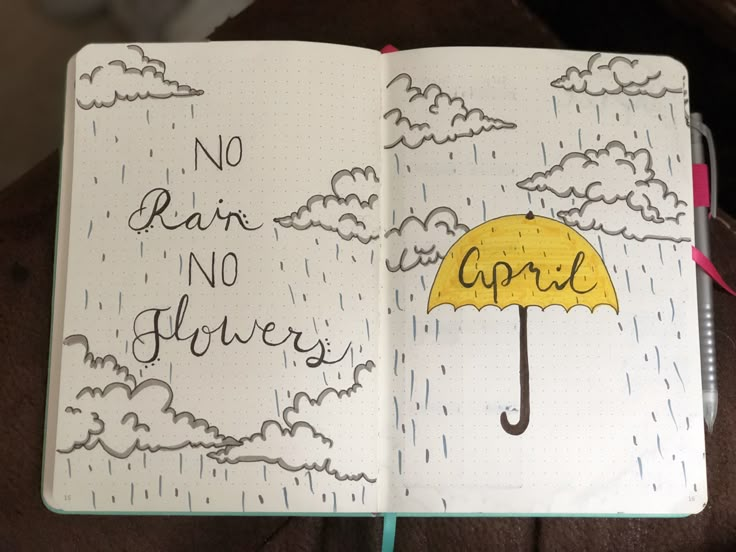 an open notebook with the words no rain, no flowers written on it and a yellow umbrella