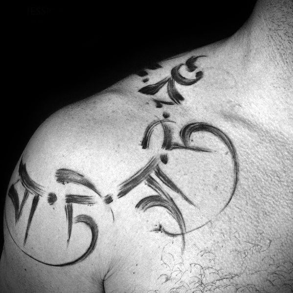 the back of a man's chest with some writing on it