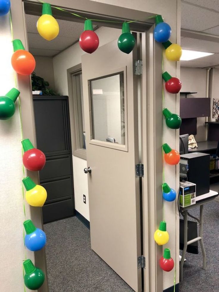 an office door decorated with balloons and streamers