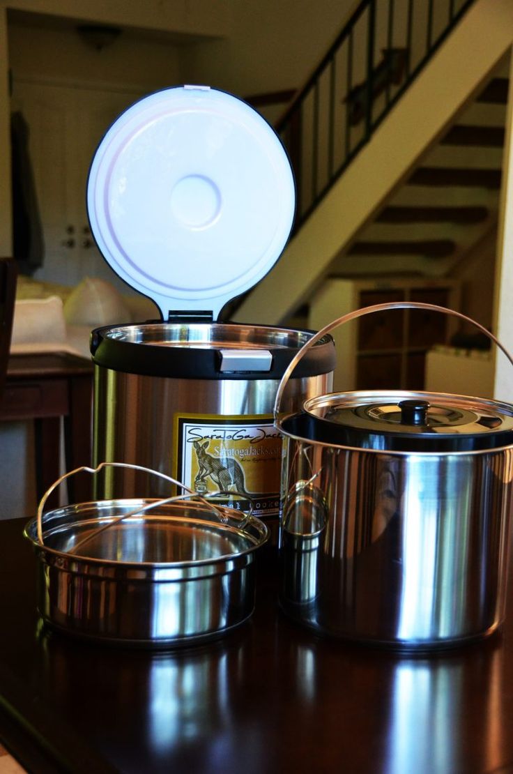 pots and pans sitting on top of a table