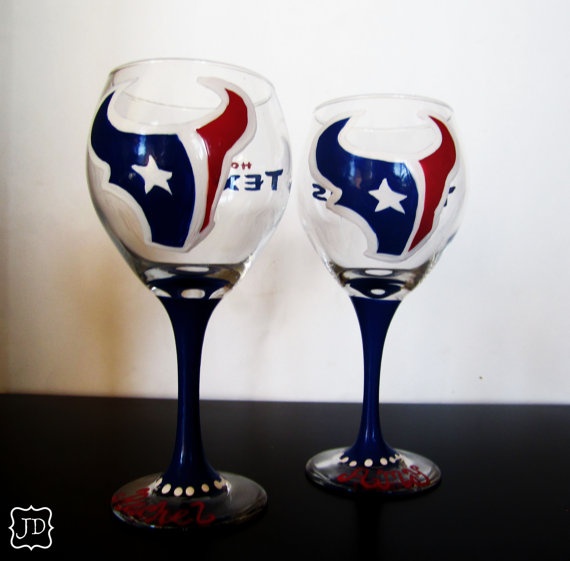 two wine glasses with the word texas painted on them