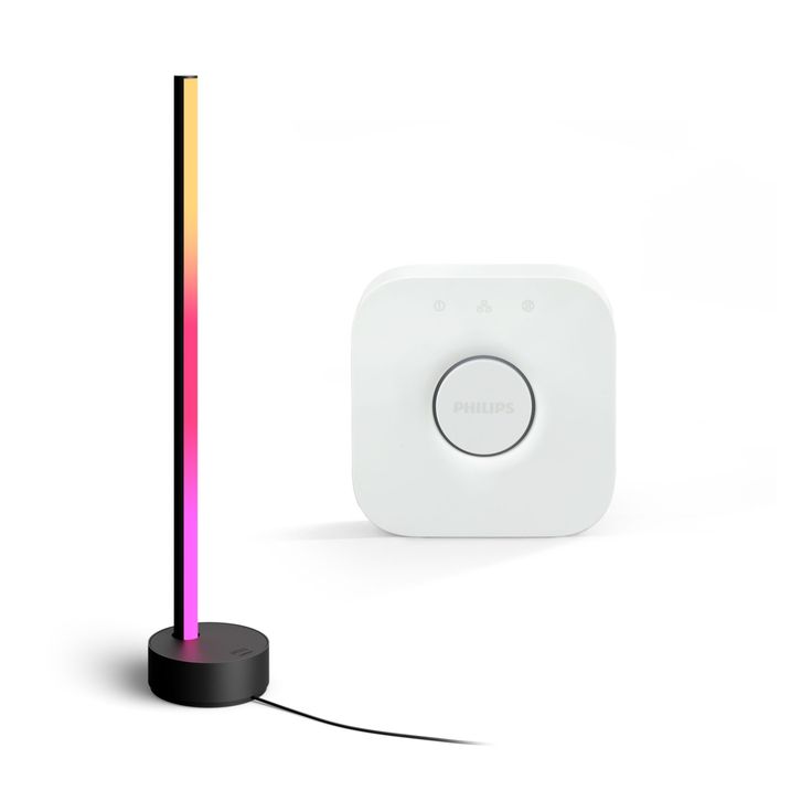 an electronic device with a colorful light on it and a black stand next to it