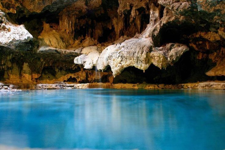 the water is blue and clear in this cave