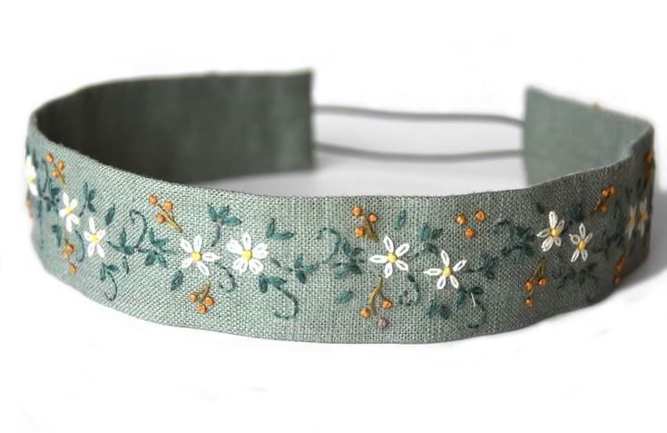 a headband with flowers and leaves on it