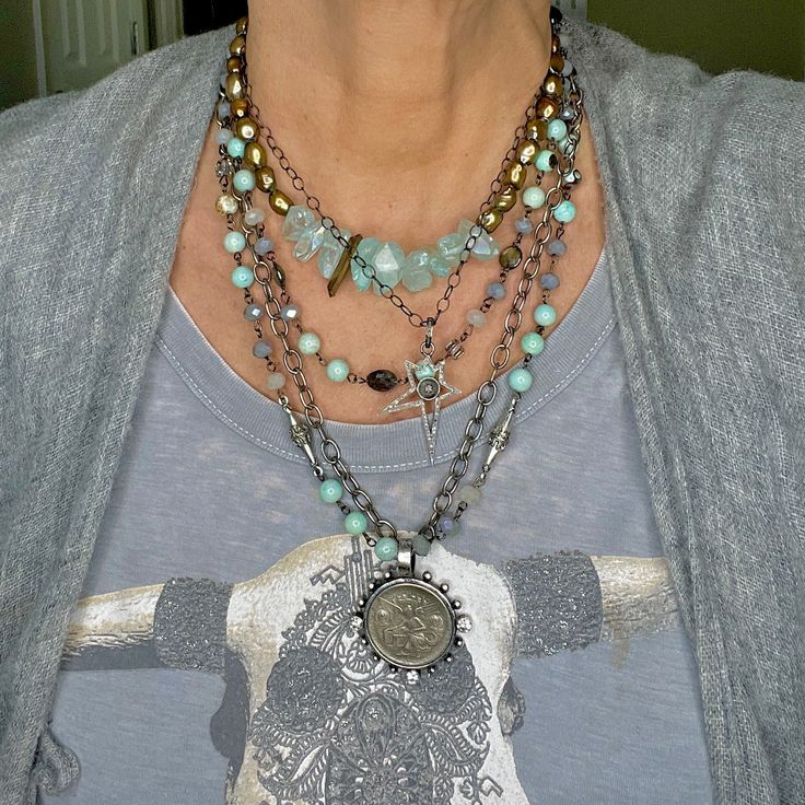 Our Double Strand Aiden Necklace is what silver dreams are made of 🩶 The historical coin tells a story of strength, determination, and the successful battle of the Alamo. Turquoise beads and crystals on one strand with decorative silver connectors and textured oval chain on the other. Measures 23.5 long, we added some extra chain for adjusting the length. Free from cadmium, lead, and nickel. Also comes sold as a three piece set which includes a strand of turquoise, crystal, labradorite gemstones, and a silver plated cross pendant. Battle Of The Alamo, Historical Coins, Single Necklace, Silver Coin Necklace, The Alamo, Silver Coin, Custom Jewelry Design, Coin Necklace, Silver Coins