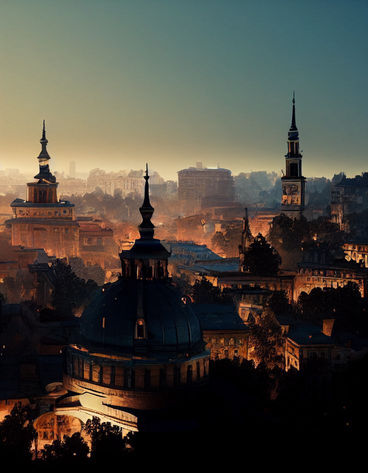 the city is lit up at night with many spires and buildings in the background