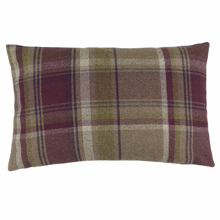 a plaid pillow on a white background