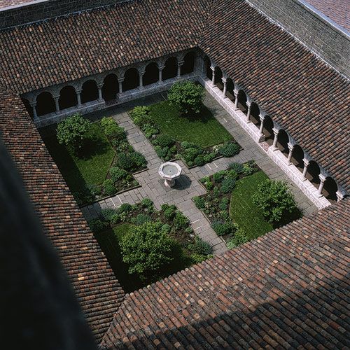 an aerial view of a courtyard and garden