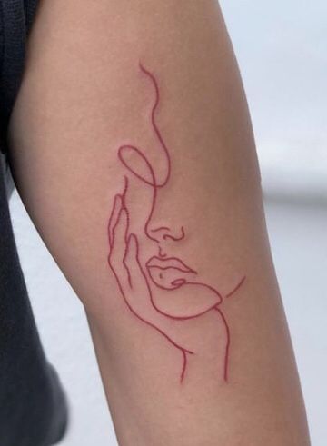 a woman's arm with a red line drawing on the left side of her body