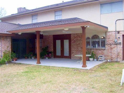 a house with a covered patio in front of it