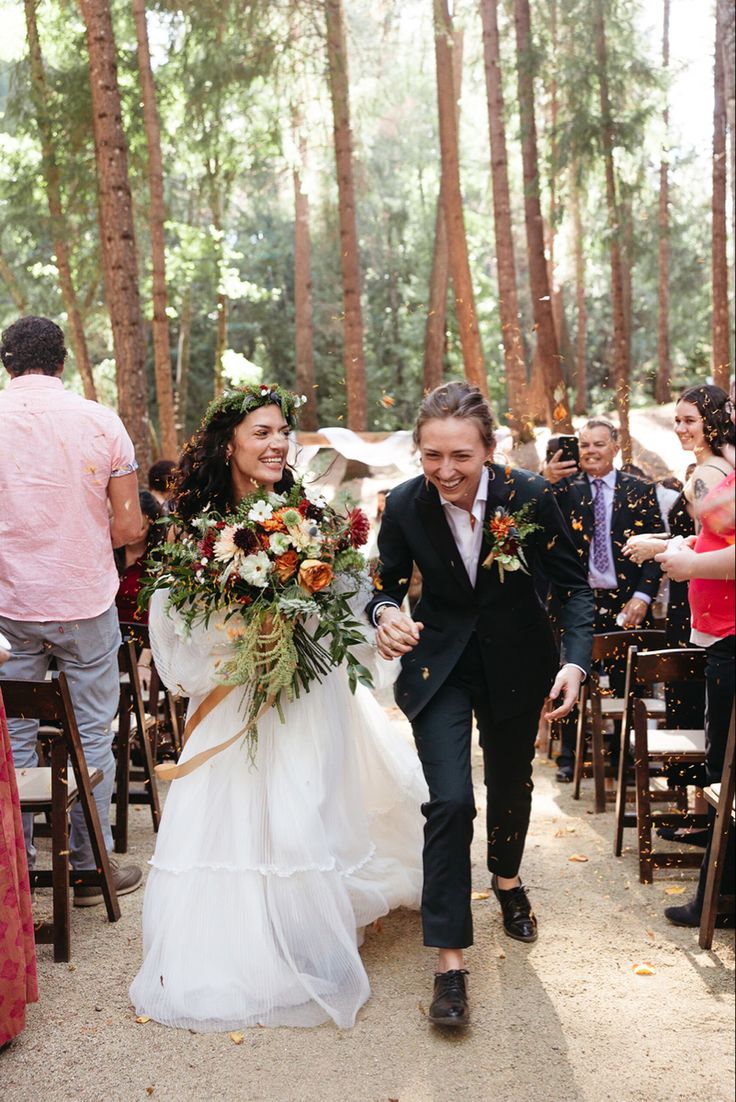 the bride and groom are walking down the aisle