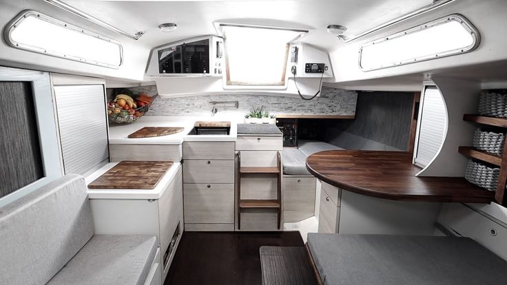 the interior of an rv with wood counter tops