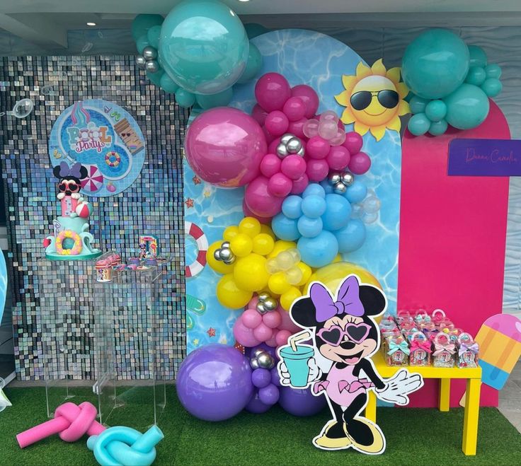 balloons and decorations are on display at the entrance to mickey mouse's birthday party