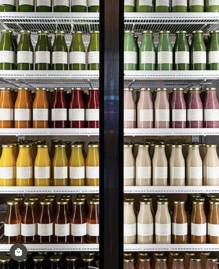 many different types of juices are on shelves in a store or restaurant, and there is no image here to provide a caption