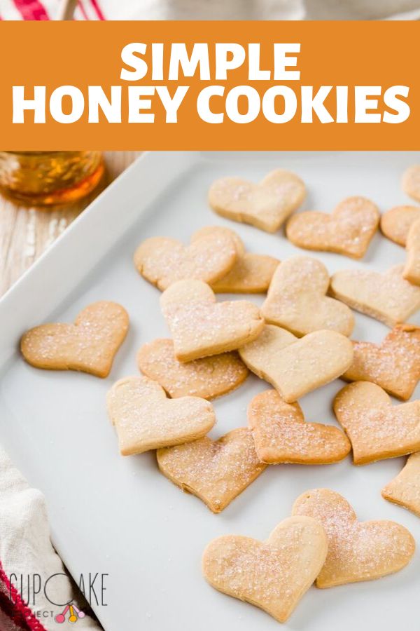 heart shaped cookies on a white plate with the words simple honey cookies overlayed