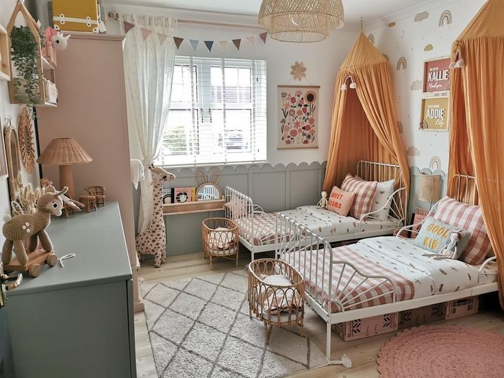 a bedroom with two twin beds in it and some curtains on the window sill