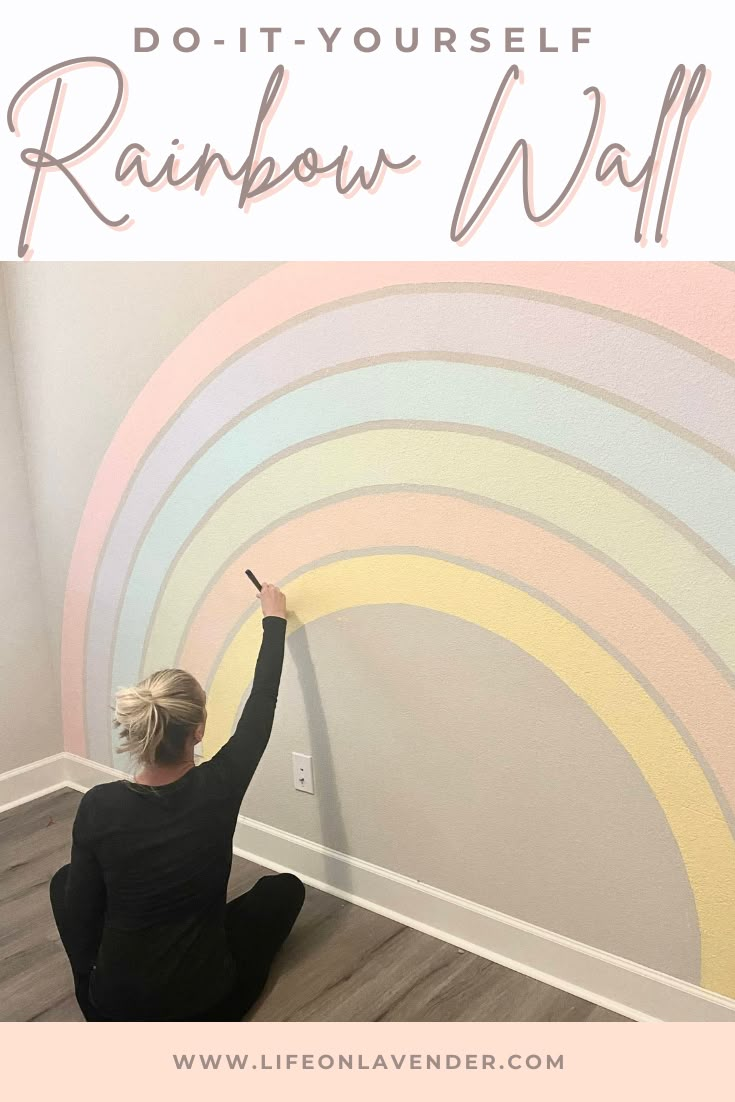 a woman sitting on the floor in front of a rainbow wall with text overlay that reads do - it - yourself rainbow wall