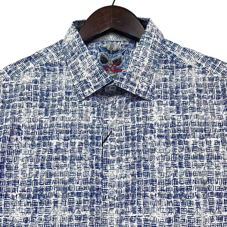 Description: * Robert Graham Men's Long Sleeve Button Front Shirt Jaskier Blue Geometric Flip Cuff * 98% Cotton, 2% Spandex * Size Large, Classic Fit (Please See Measurements In The Description Before Purchasing) * Made In India * New With Tags Measurements: * Sleeve Length (Shoulder Seam To Cuff): 9 1/2 Inches * Chest (Armpit To Armpit): 23 1/2 Inches * Length (Base Of Back Collar To Bottom Edge): 31 Inches Casual Navy Long Sleeve Dress Shirt, Summer Shirt With Fold Down Collar And Placket, Summer Shirt With Placket And Fold Down Collar, Designer Blue Shirt With Spread Collar, Designer Fitted Button-up Shirt, Designer Blue Shirt With Button Closure, Navy Casual Shirt For Business, Modern Blue Tops With Button Closure, Business Shirt With Fold Down Collar For Summer