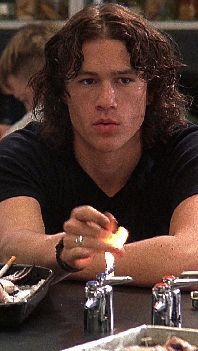 a man sitting at a table with food in front of him