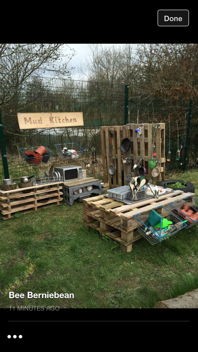 some wooden pallets sitting in the grass