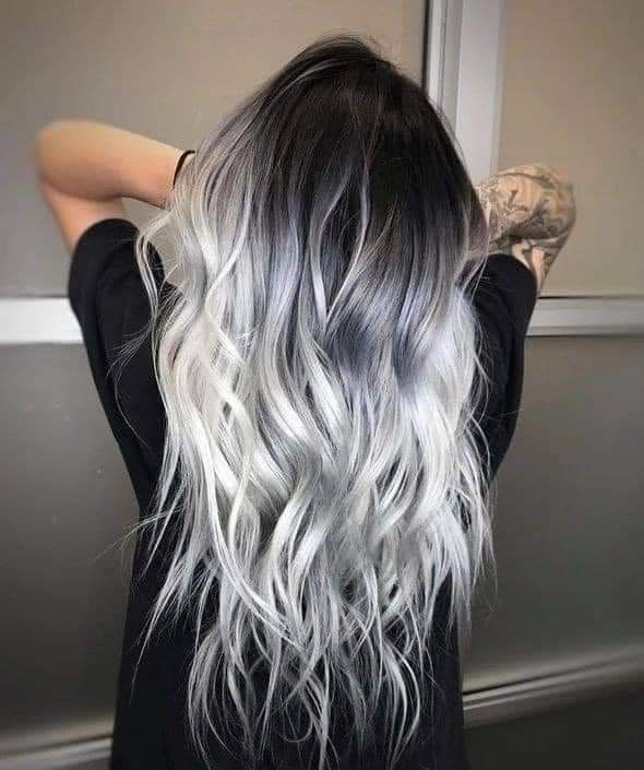 the back of a woman's head with grey and white hair