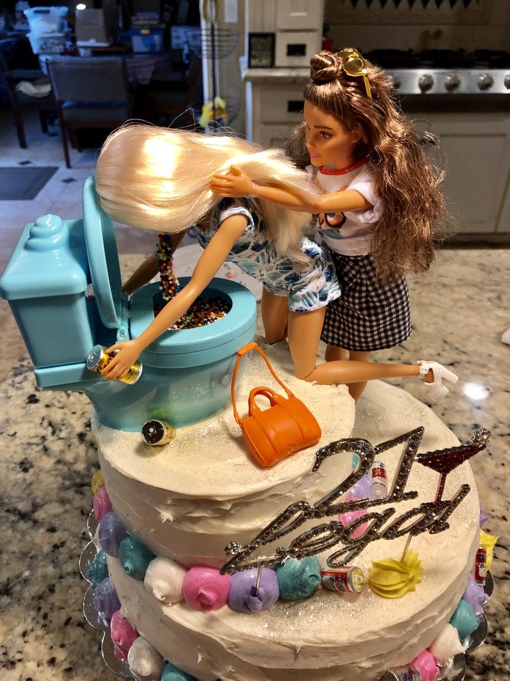 there is a barbie doll on top of a birthday cake that has been made to look like she's having fun