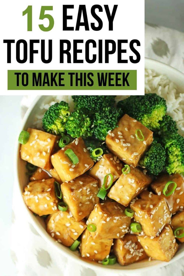 a bowl filled with tofu and broccoli on top of rice next to chopsticks