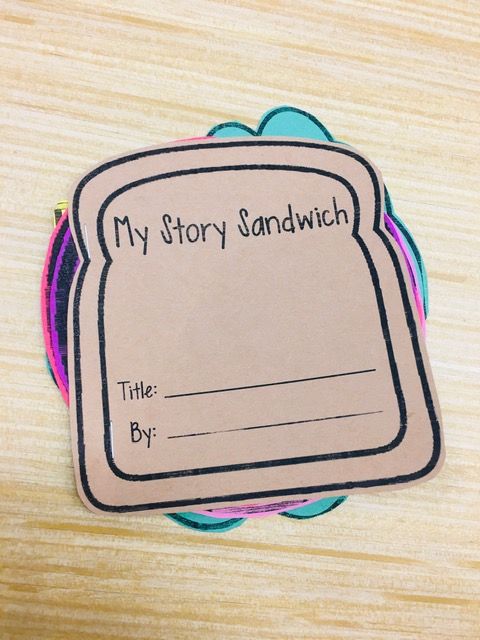 a close up of a piece of paper on a wooden table with a sign that says, my story sandwich