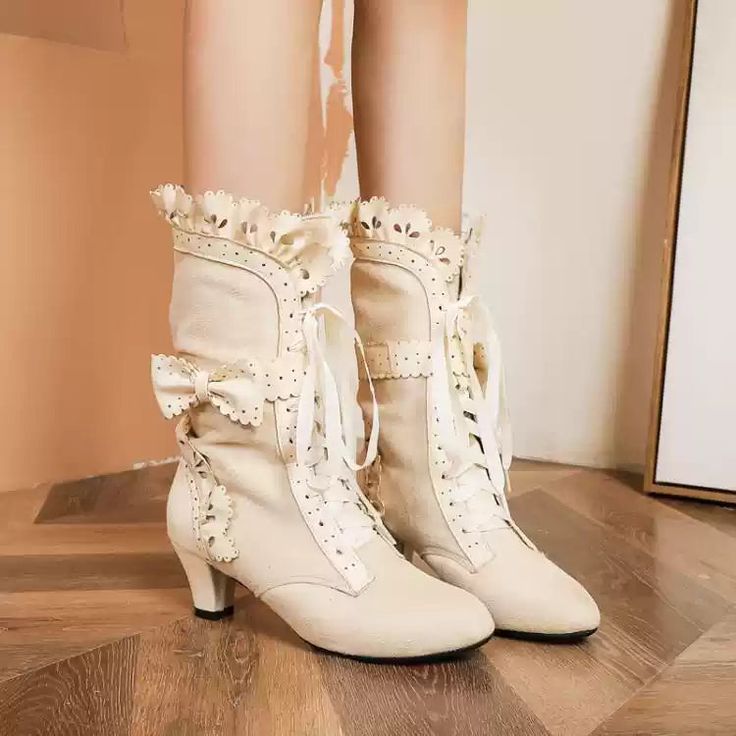 Step back in time with these exquisitely crafted Vintage Victorian Lace-Up Ankle Boots, designed for those who appreciate a touch of retro elegance. These stunning boots feature a lace-up front adorned with delicate bows and intricate scalloped edges, reminiscent of historical fashion from the Victorian era. Perfect for Regency or Bridgerton-inspired looks, these boots will elevate your outfit with their charming and sophisticated style. Timeless Design: Inspired by Victorian and Regency styles, these boots capture the essence of vintage fashion with their lace-up front, decorative bows, and scalloped trims, adding a whimsical touch to any ensemble. Comfortable Fit: Lined with soft faux fur, these boots provide a cozy feel, ideal for all-day wear. The sturdy 5-8 cm (2-3 inches) heels offer