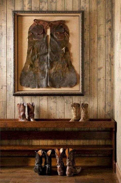 two pairs of shoes are sitting on a bench in front of a painting