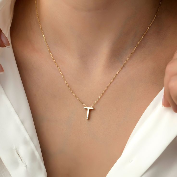 14k Gold Minimal T Letter Necklace, Letter Necklace, Gold Necklaces, 14k Gold Necklace, Necklace for Love, Necklace for Name ITEM DETAILS ❆ All our jewelleries are handmade with Love and Care 💓 ❆ Material: 14K Gold. ❆ Gram: 2,00 gr ❆ Each item is made to order. Since all of our products are handmade, there may be -) 10% deviation in the specified weight. ❆ DO YOU LIKE THIS RING? You can get more information about it below but if you have any questions, just send a message. PACKAGING ❆ They are Tan 14k Gold Necklaces With Initials, Tan Pendant Necklace For Gift, Tan Pendant Necklace For Gifts, Elegant Tan Charm Necklace For Gift, Elegant Tan Necklaces For Gifts, Elegant Tan Necklace For Gift, Tan 14k Gold Jewelry For Gift, Elegant Sterling Silver Tan Necklace, Dainty Tan Necklace For Everyday