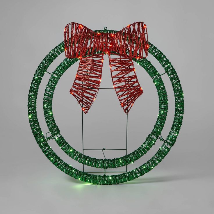 a green and red christmas decoration with lights