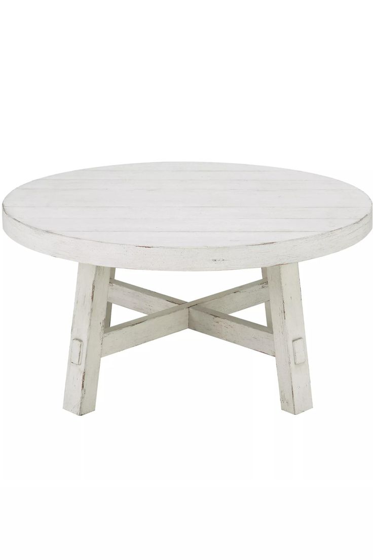 a white wooden table with two crossed legs