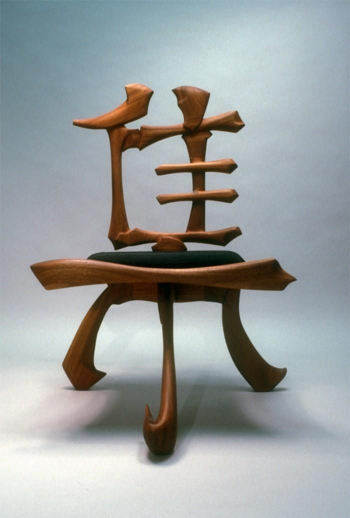 a chair made out of wood with two birds on it