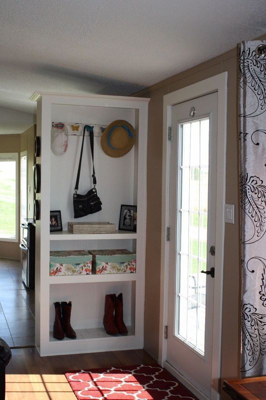 the entryway is clean and ready to be used as a storage area for shoes