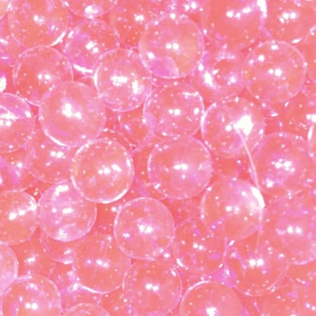 many pink bubbles floating on top of each other