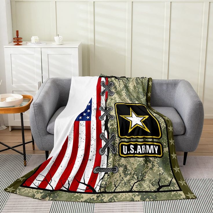 an army blanket with the u s army insignia on it is sitting in a chair