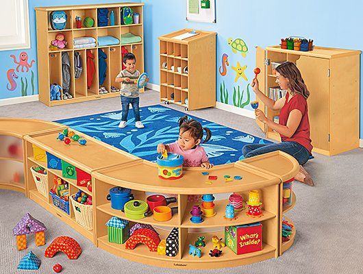 a child's play room with toys and children's bookshelves on the floor