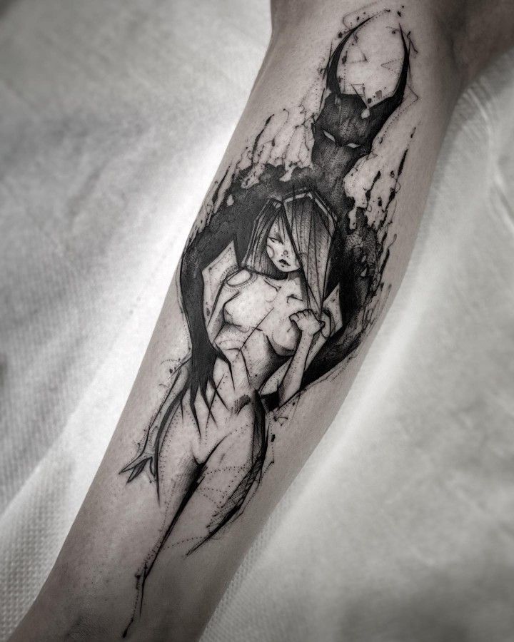 a black and white photo of a woman's arm with an ink painting on it